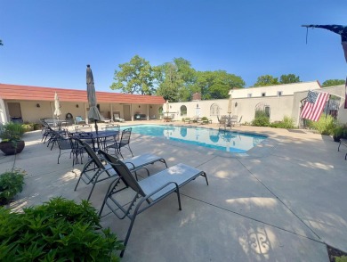 Welcome to 49 E Via Roma, a refined 2-bedroom, 3-bath townhome on Crestview Country Club in Kansas - for sale on GolfHomes.com, golf home, golf lot