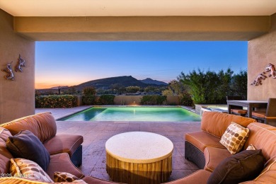 As you enter, you're greeted by soaring ceilings and walls of on Desert Mountain Golf Club - Renegade Course in Arizona - for sale on GolfHomes.com, golf home, golf lot