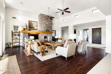 As you enter, you're greeted by soaring ceilings and walls of on Desert Mountain Golf Club - Renegade Course in Arizona - for sale on GolfHomes.com, golf home, golf lot