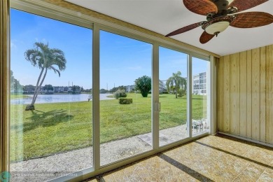 GROUND FLOOR unit with LAKE VIEW located in the desirable on Hillsboro Pines Golf in Florida - for sale on GolfHomes.com, golf home, golf lot