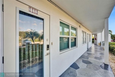 GROUND FLOOR unit with LAKE VIEW located in the desirable on Hillsboro Pines Golf in Florida - for sale on GolfHomes.com, golf home, golf lot