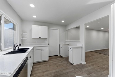 Ideally situated on a corner lot, this stunning home has on Leisure World Country Club in Arizona - for sale on GolfHomes.com, golf home, golf lot