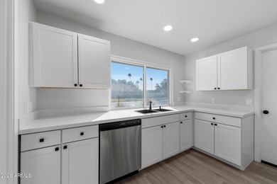 Ideally situated on a corner lot, this stunning home has on Leisure World Country Club in Arizona - for sale on GolfHomes.com, golf home, golf lot