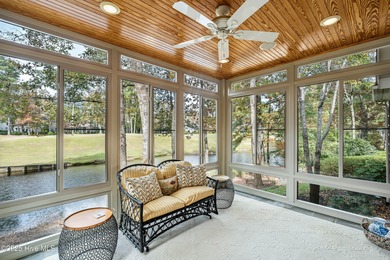Privately nestled among mature trees with serene pond views and on Porters Neck Country Club in North Carolina - for sale on GolfHomes.com, golf home, golf lot