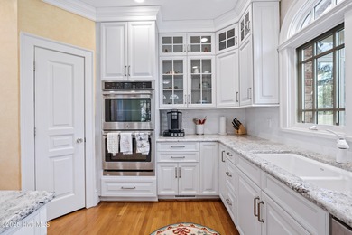 Privately nestled among mature trees with serene pond views and on Porters Neck Country Club in North Carolina - for sale on GolfHomes.com, golf home, golf lot