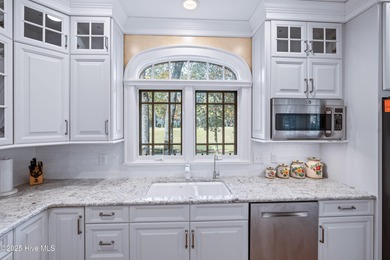 Privately nestled among mature trees with serene pond views and on Porters Neck Country Club in North Carolina - for sale on GolfHomes.com, golf home, golf lot