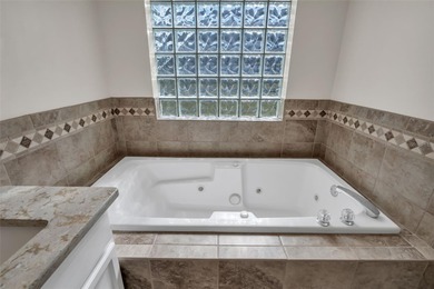 Under contract-accepting backup offers. AGGRESSIVELY PRICED and on Ridgewood Lakes Golf and Country Club in Florida - for sale on GolfHomes.com, golf home, golf lot