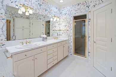 Privately nestled among mature trees with serene pond views and on Porters Neck Country Club in North Carolina - for sale on GolfHomes.com, golf home, golf lot