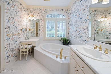 Privately nestled among mature trees with serene pond views and on Porters Neck Country Club in North Carolina - for sale on GolfHomes.com, golf home, golf lot