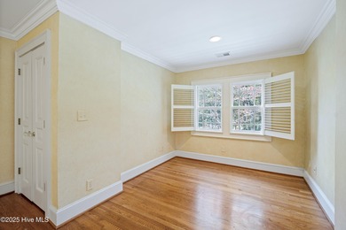 Privately nestled among mature trees with serene pond views and on Porters Neck Country Club in North Carolina - for sale on GolfHomes.com, golf home, golf lot