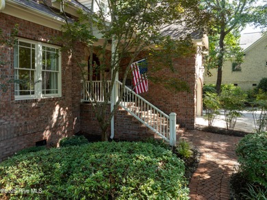 Privately nestled among mature trees with serene pond views and on Porters Neck Country Club in North Carolina - for sale on GolfHomes.com, golf home, golf lot