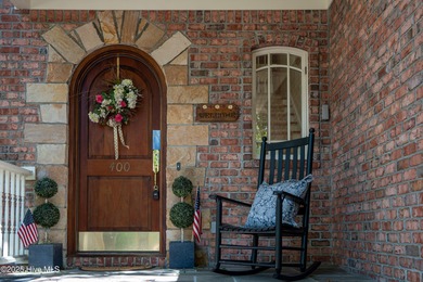 Privately nestled among mature trees with serene pond views and on Porters Neck Country Club in North Carolina - for sale on GolfHomes.com, golf home, golf lot