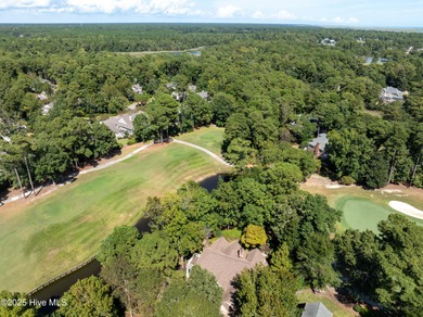Privately nestled among mature trees with serene pond views and on Porters Neck Country Club in North Carolina - for sale on GolfHomes.com, golf home, golf lot