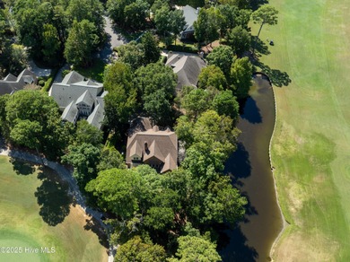 Privately nestled among mature trees with serene pond views and on Porters Neck Country Club in North Carolina - for sale on GolfHomes.com, golf home, golf lot