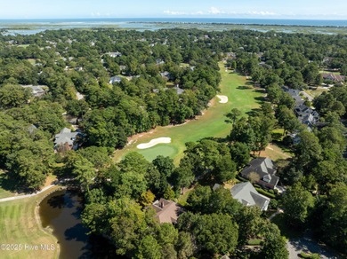 Privately nestled among mature trees with serene pond views and on Porters Neck Country Club in North Carolina - for sale on GolfHomes.com, golf home, golf lot