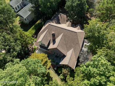 Privately nestled among mature trees with serene pond views and on Porters Neck Country Club in North Carolina - for sale on GolfHomes.com, golf home, golf lot