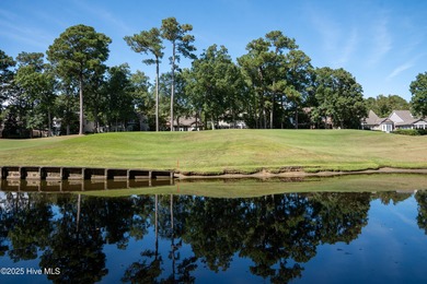 Privately nestled among mature trees with serene pond views and on Porters Neck Country Club in North Carolina - for sale on GolfHomes.com, golf home, golf lot