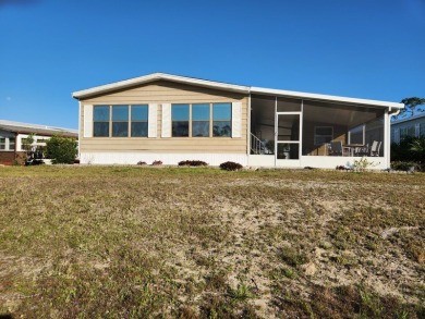 Spacious two-bedroom, two-bath home located in the gated golf on Lake Fairways Country Club in Florida - for sale on GolfHomes.com, golf home, golf lot