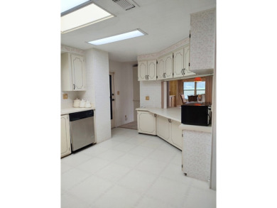 Spacious two-bedroom, two-bath home located in the gated golf on Lake Fairways Country Club in Florida - for sale on GolfHomes.com, golf home, golf lot