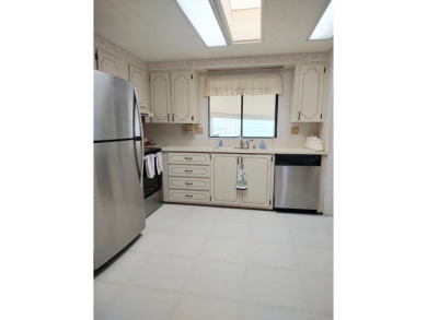 Spacious two-bedroom, two-bath home located in the gated golf on Lake Fairways Country Club in Florida - for sale on GolfHomes.com, golf home, golf lot