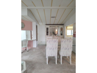 Spacious two-bedroom, two-bath home located in the gated golf on Lake Fairways Country Club in Florida - for sale on GolfHomes.com, golf home, golf lot