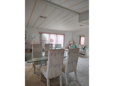 Spacious two-bedroom, two-bath home located in the gated golf on Lake Fairways Country Club in Florida - for sale on GolfHomes.com, golf home, golf lot