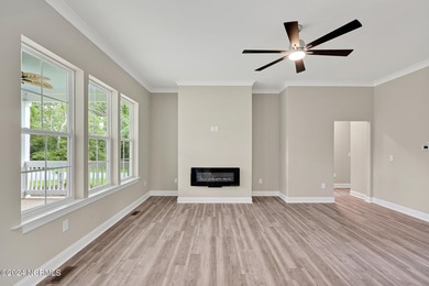 Welcome to your coastal haven, nestled among ancient oaks along on Lockwood Folly Country Club in North Carolina - for sale on GolfHomes.com, golf home, golf lot