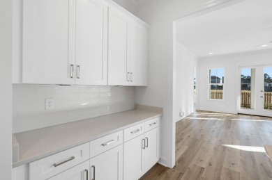 This Bella XL plan, with an alternate elevation, has 3 bedrooms on Origins Golf Club in Florida - for sale on GolfHomes.com, golf home, golf lot