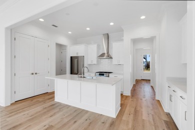 This Bella XL plan, with an alternate elevation, has 3 bedrooms on Origins Golf Club in Florida - for sale on GolfHomes.com, golf home, golf lot