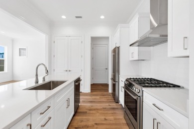 This Bella XL plan, with an alternate elevation, has 3 bedrooms on Origins Golf Club in Florida - for sale on GolfHomes.com, golf home, golf lot
