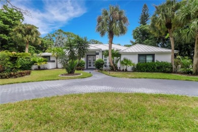 This beautifully redesigned home is nestled on an oversized lot on Imperial Golf Club in Florida - for sale on GolfHomes.com, golf home, golf lot