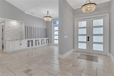 This beautifully redesigned home is nestled on an oversized lot on Imperial Golf Club in Florida - for sale on GolfHomes.com, golf home, golf lot