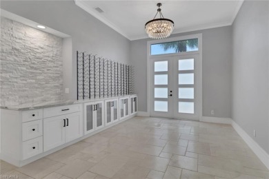 This beautifully redesigned home is nestled on an oversized lot on Imperial Golf Club in Florida - for sale on GolfHomes.com, golf home, golf lot