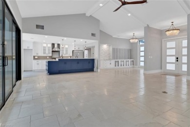 This beautifully redesigned home is nestled on an oversized lot on Imperial Golf Club in Florida - for sale on GolfHomes.com, golf home, golf lot