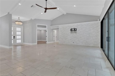 This beautifully redesigned home is nestled on an oversized lot on Imperial Golf Club in Florida - for sale on GolfHomes.com, golf home, golf lot