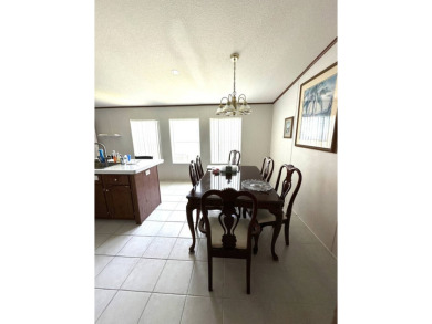 Discover this charming and well-maintained 3-bedroom home on Schalamar Creek Golf and Country Club in Florida - for sale on GolfHomes.com, golf home, golf lot