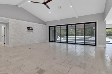 This beautifully redesigned home is nestled on an oversized lot on Imperial Golf Club in Florida - for sale on GolfHomes.com, golf home, golf lot