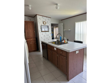 Discover this charming and well-maintained 3-bedroom home on Schalamar Creek Golf and Country Club in Florida - for sale on GolfHomes.com, golf home, golf lot