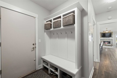 This zero-entry ranch home offers a blend of comfort and modern on Otter Creek Golf Course in Iowa - for sale on GolfHomes.com, golf home, golf lot