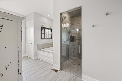 This zero-entry ranch home offers a blend of comfort and modern on Otter Creek Golf Course in Iowa - for sale on GolfHomes.com, golf home, golf lot