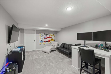 This zero-entry ranch home offers a blend of comfort and modern on Otter Creek Golf Course in Iowa - for sale on GolfHomes.com, golf home, golf lot