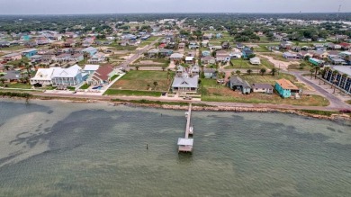 This adorable cozy coastal cottage sits on a large lot just 2 on Rockport Country Club in Texas - for sale on GolfHomes.com, golf home, golf lot