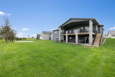 This zero-entry ranch home offers a blend of comfort and modern on Otter Creek Golf Course in Iowa - for sale on GolfHomes.com, golf home, golf lot