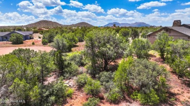 Nestled in a serene and private setting, this beautifully treed on Talking Rock Golf Club in Arizona - for sale on GolfHomes.com, golf home, golf lot