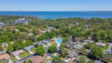 Massive corner lot home located in highly desired Mack Bayou on Sandestin Golf and Beach Resort - Raven in Florida - for sale on GolfHomes.com, golf home, golf lot