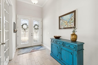 Live where every day feels like a getaway in this beautifully on Amelia National Golf and Country Club in Florida - for sale on GolfHomes.com, golf home, golf lot