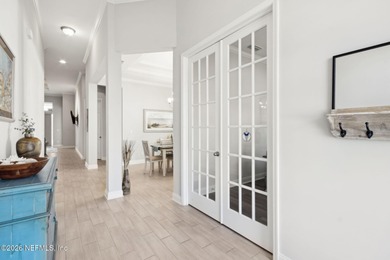 Live where every day feels like a getaway in this beautifully on Amelia National Golf and Country Club in Florida - for sale on GolfHomes.com, golf home, golf lot