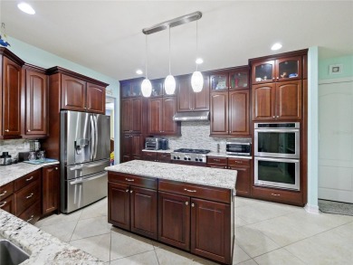 This stunning five-bedroom, four-bathroom pool home is located on Eagle Creek Golf Club in Florida - for sale on GolfHomes.com, golf home, golf lot