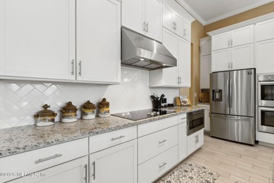 Live where every day feels like a getaway in this beautifully on Amelia National Golf and Country Club in Florida - for sale on GolfHomes.com, golf home, golf lot