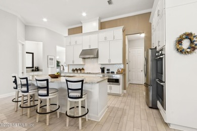 Live where every day feels like a getaway in this beautifully on Amelia National Golf and Country Club in Florida - for sale on GolfHomes.com, golf home, golf lot